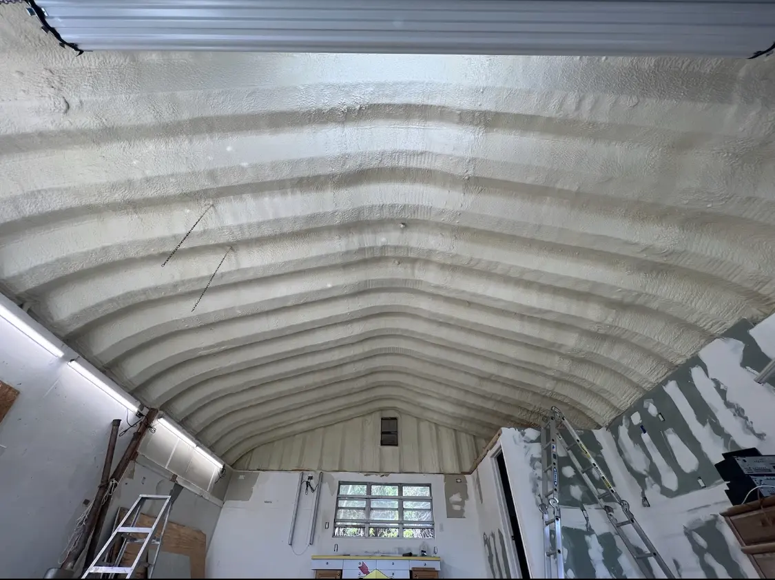 Spray polyurethane foam applied to the underside of a metal roof deck in Irondequoit